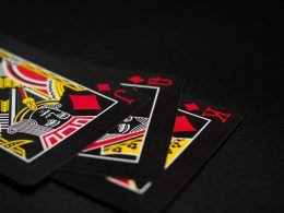 black playing cards on black background