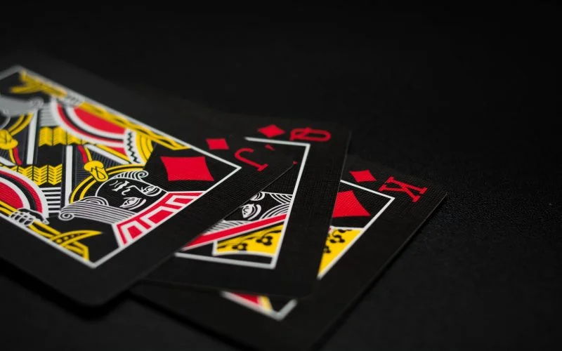 black playing cards on black background