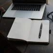 a pen on a notebook