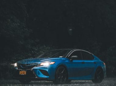 blue car on rainy night